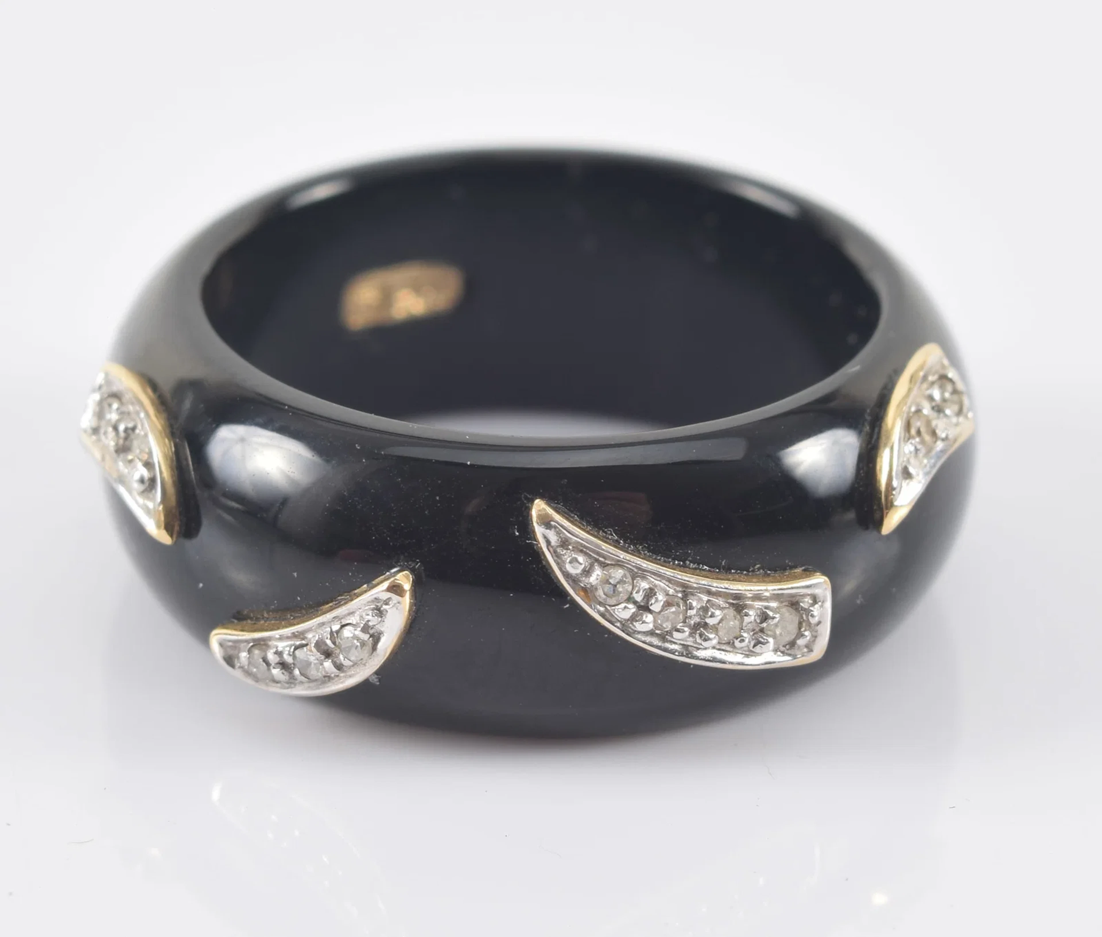 14K gold mounted onyx and diamond ring. Onyx band with yellow gold