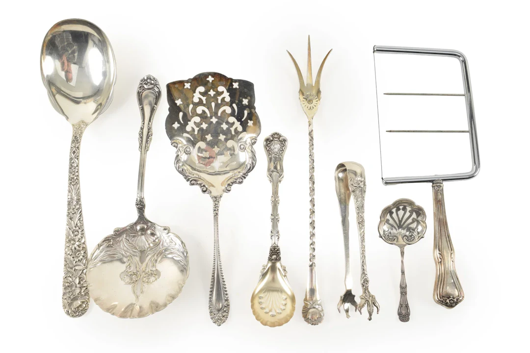 6 Sterling silver serving items including pierced spoons, pickle forks
