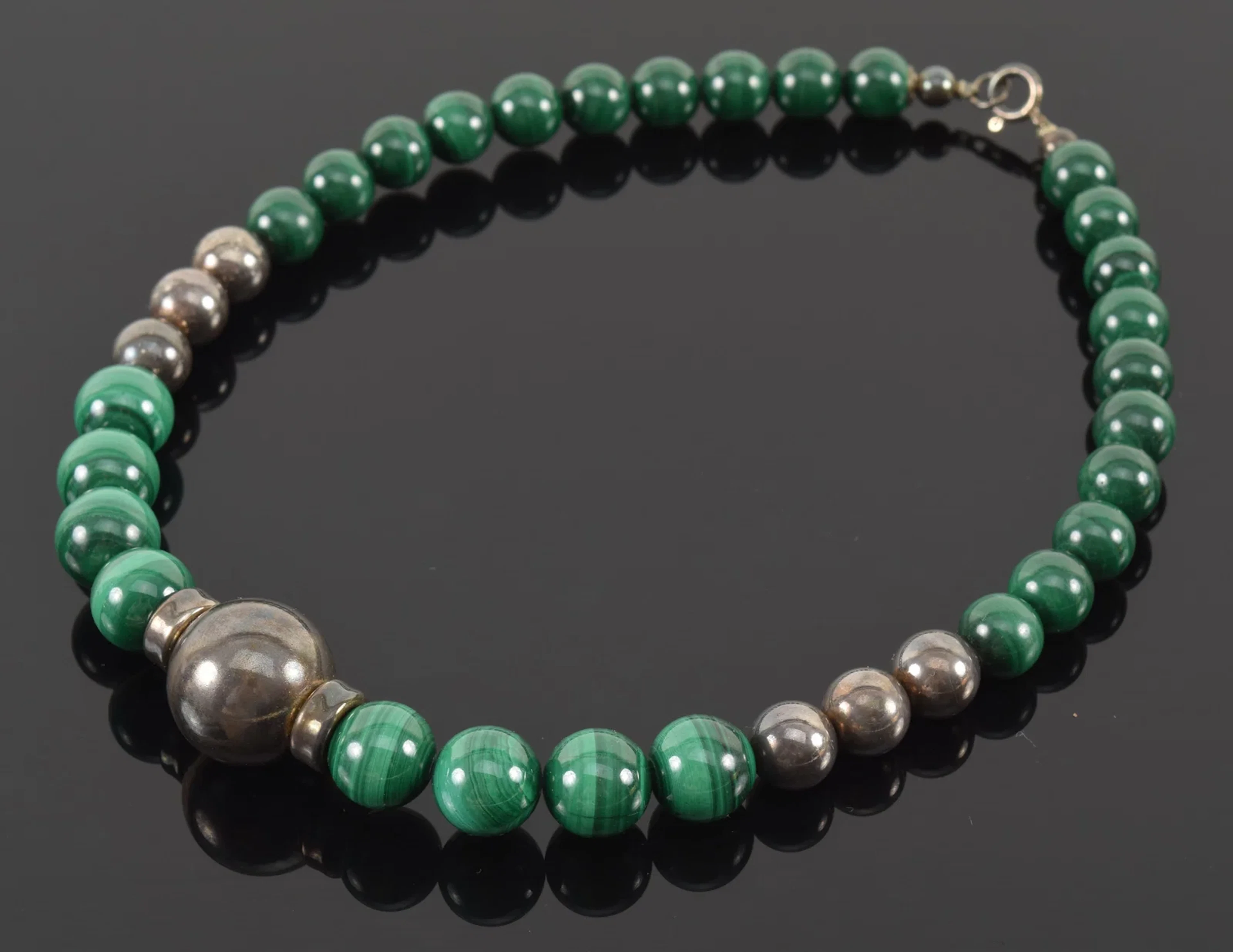 Silver and malachite graduated bead necklace. 16in length.