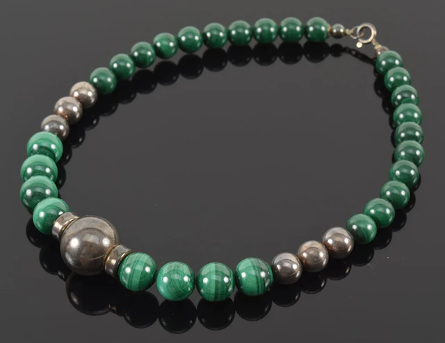 Silver and malachite graduated bead necklace. 16in length.