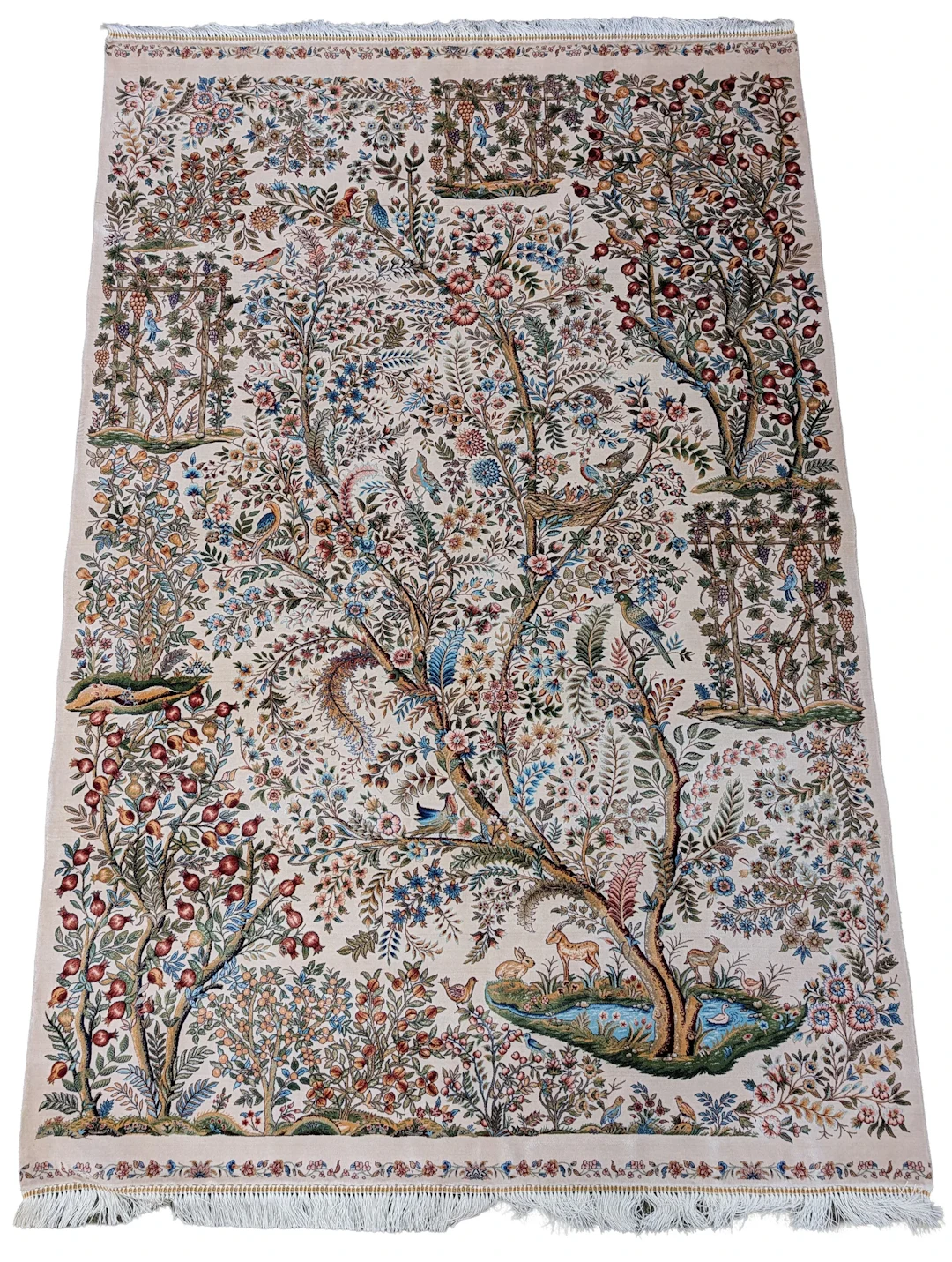 Silk Qum area rug. Decoration of birds, animals, pomegranates, and