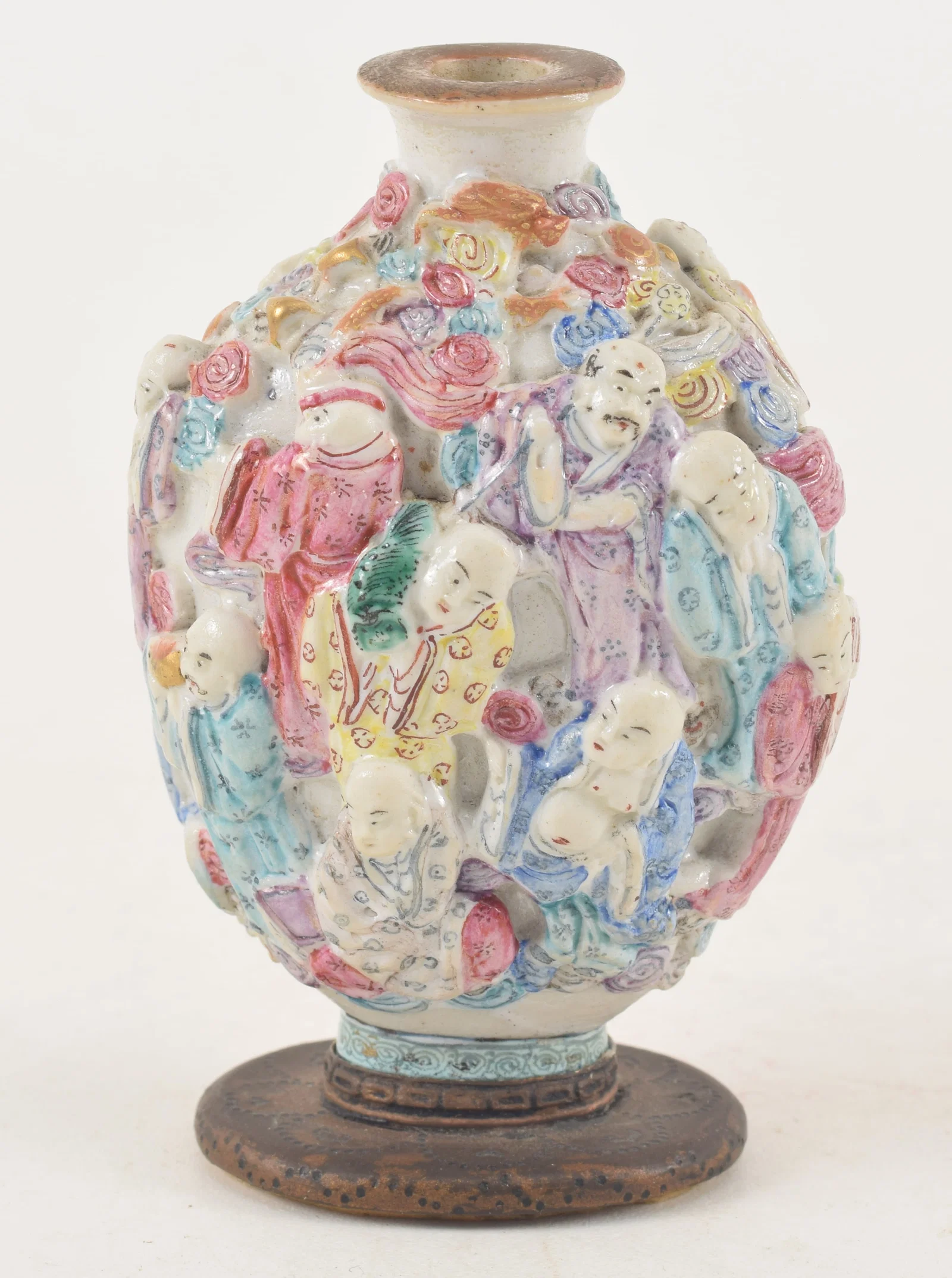 19th century Chinese porcelain snuff bottle. Polychrome carved and