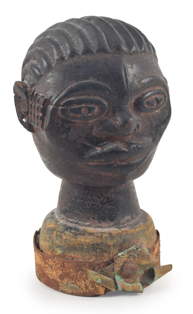 West Africa carved figural bust fitted with metal banding. Height 10 in.