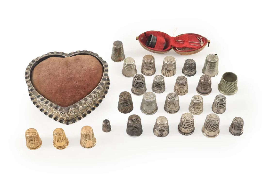 Lot of thimbles including gold and silver. 18 silver at 2.38 ozt.