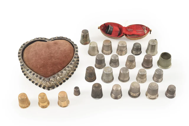 Lot of thimbles including gold and silver. 18 silver at 2.38 ozt.