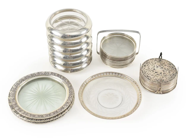 Collection of Sterling silver framed coasters, including a heavy set