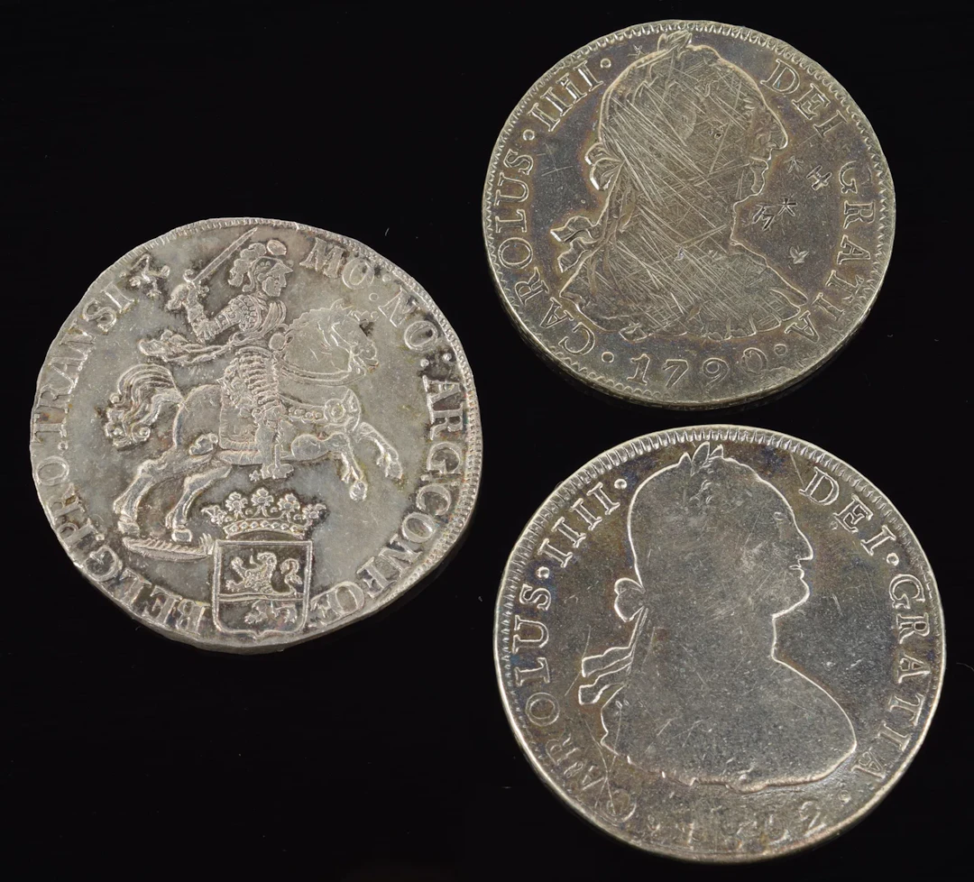 3 silver coins. To include: 1) 1734 Dutch "Silver Rider" coin. 32.4