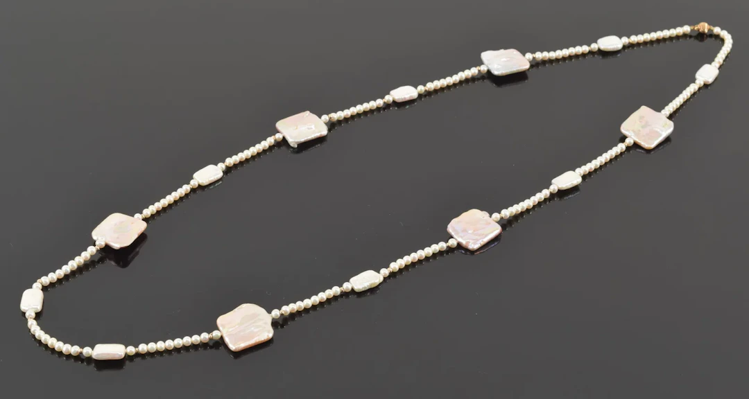 14K gold pearl and mother of pearl designer necklace. Single pearl