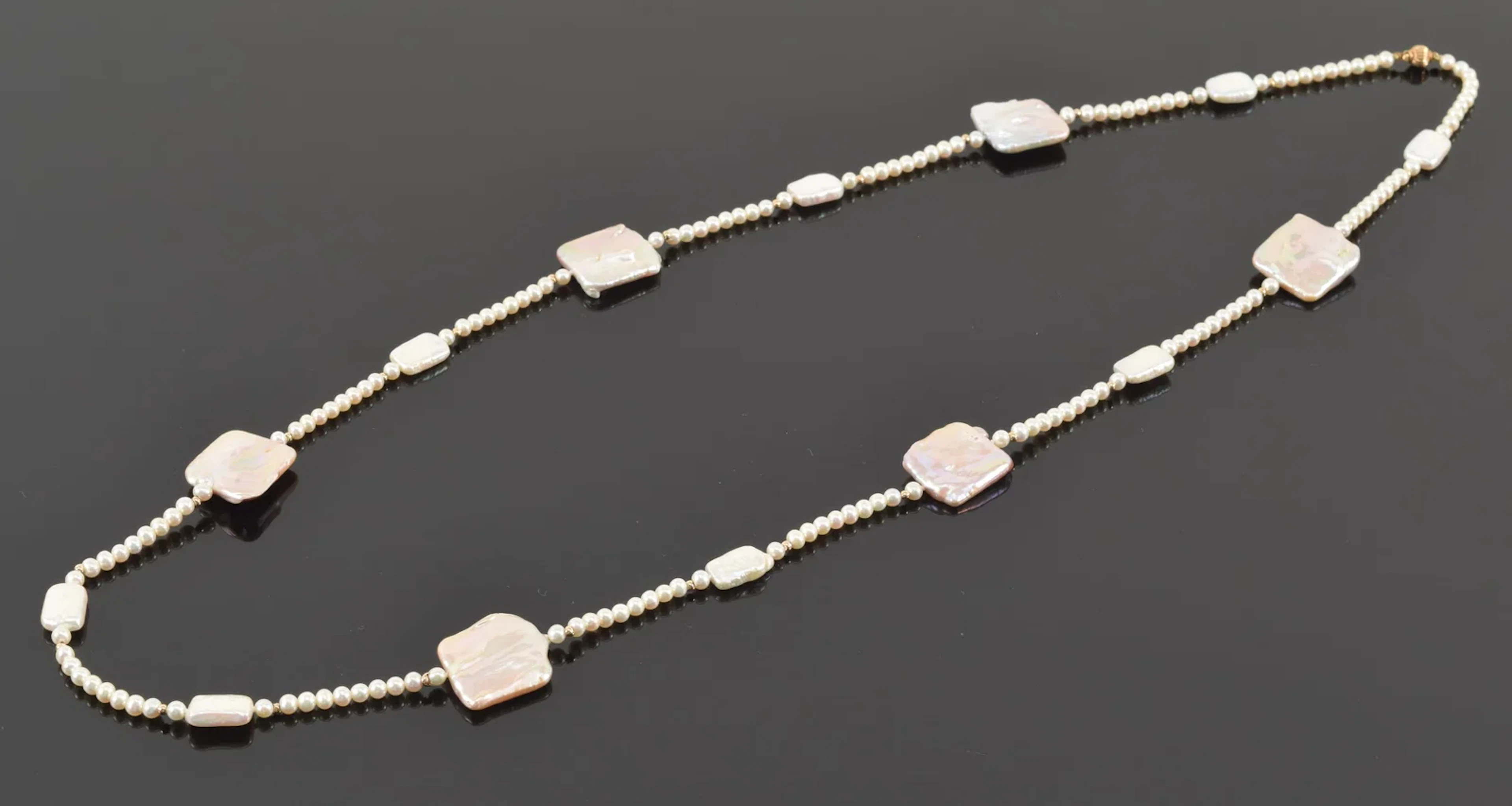 14K gold pearl and mother of pearl designer necklace. Single pearl