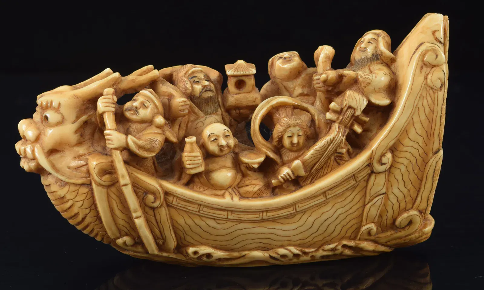 large-netsuke-carving-of-the-ship-of-wealth-japan-19th-century