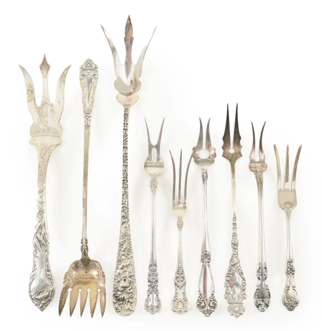 Collection of 9 Sterling silver pickle and olive forks, including