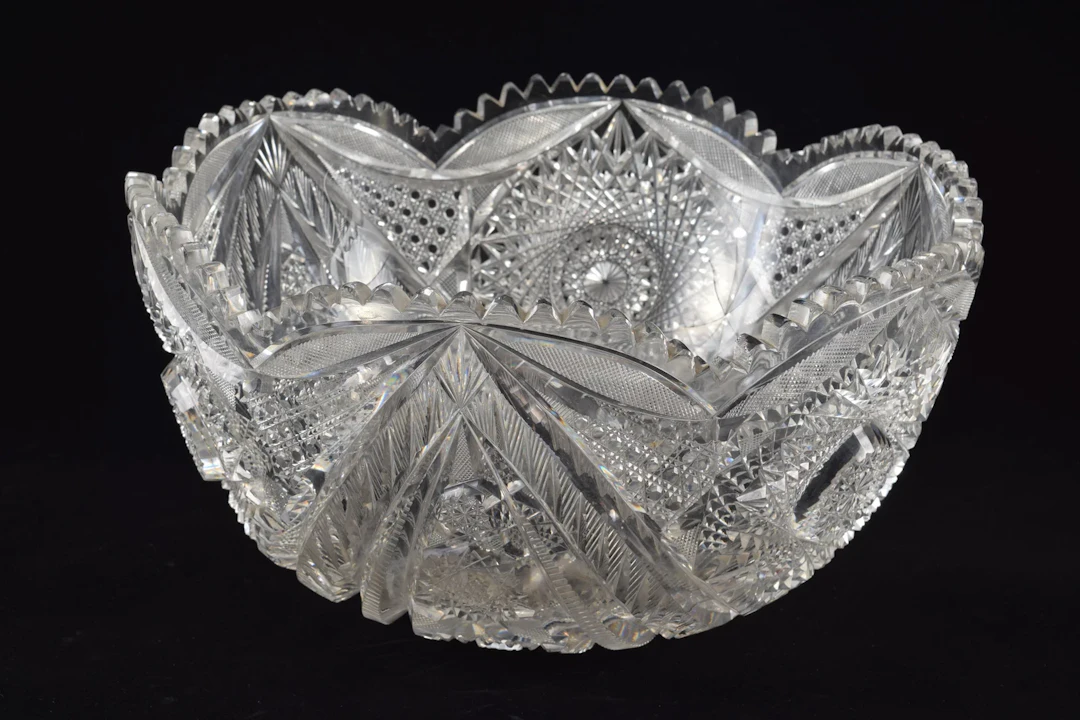 Large cut glass punch bowl with bold pinwheel decorations.. Diameter 14 in.