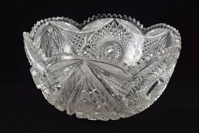Large cut glass punch bowl with bold pinwheel decorations.. Diameter 14 in.