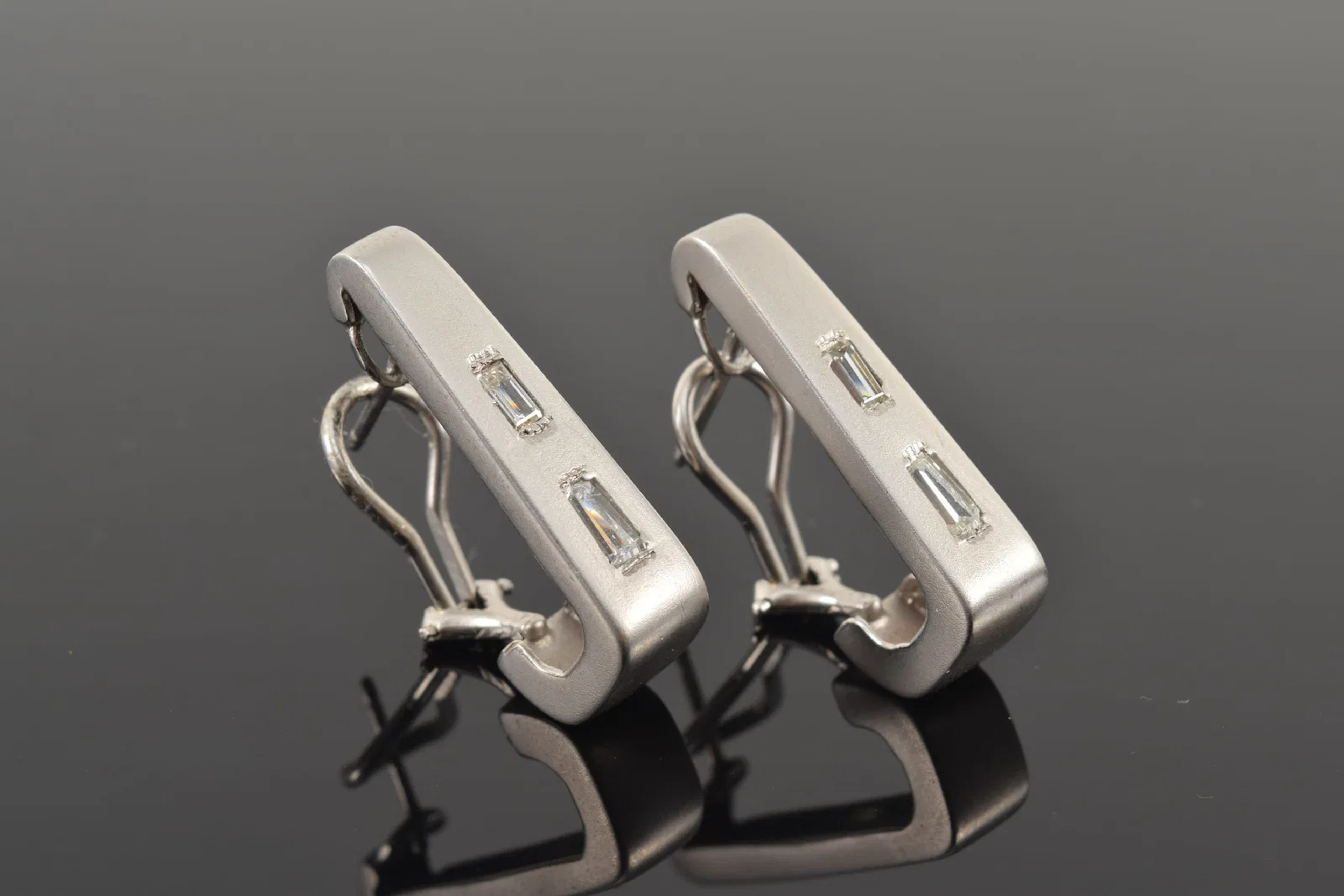 14K white gold diamond earrings. Matte finish J-form clip earrings
