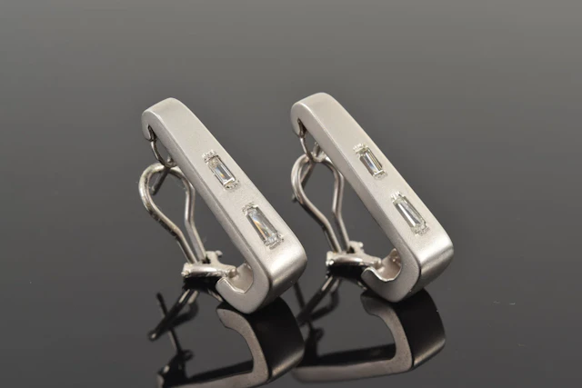 14K white gold diamond earrings. Matte finish J-form clip earrings