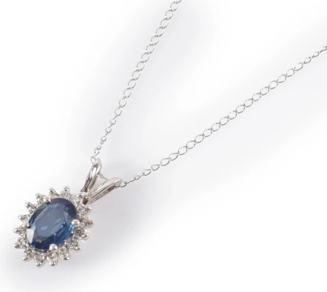 14K white gold sapphire and diamond pendant necklace. Oval cut sapphire