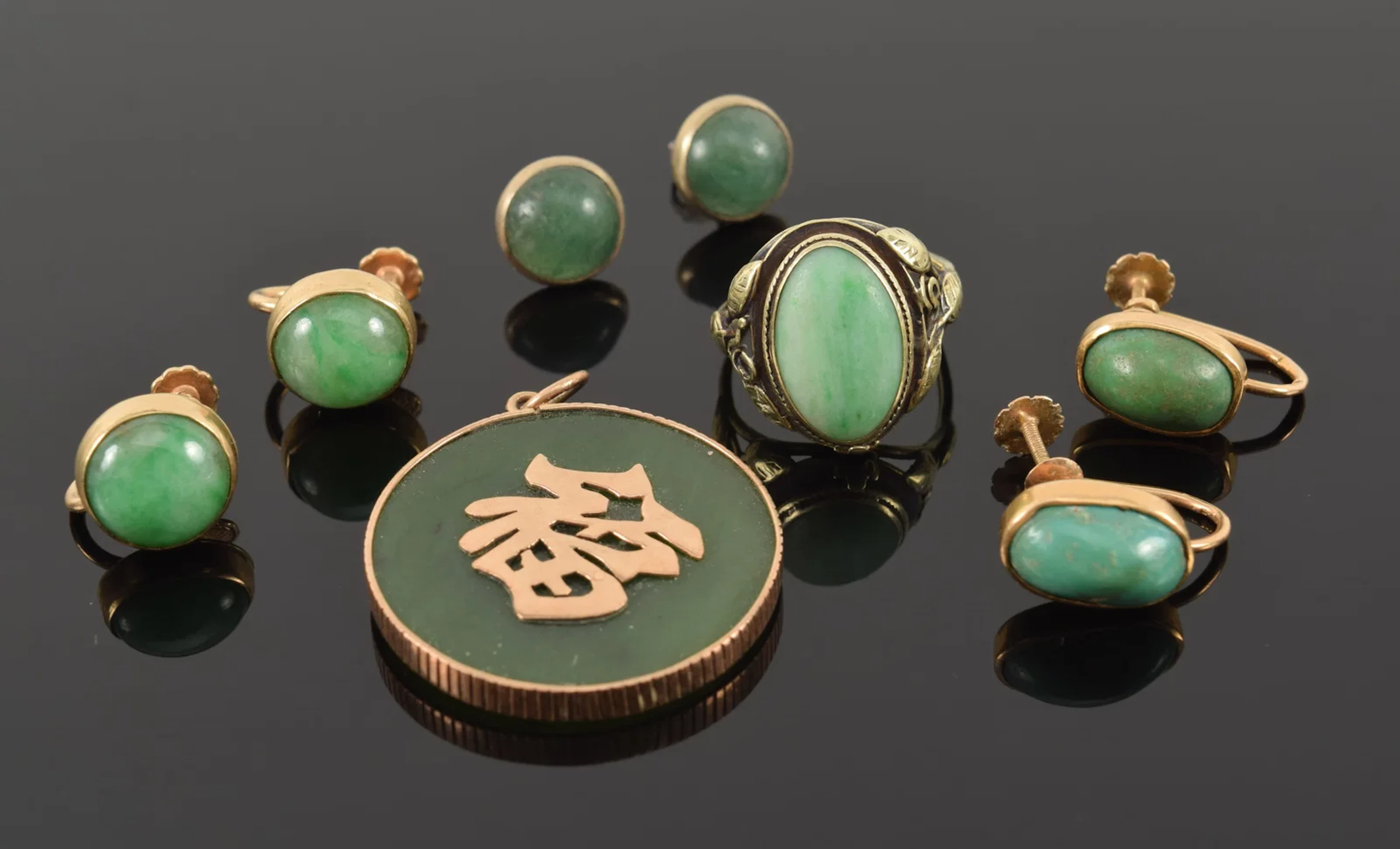 Assortment of jewelry. To include: 1) Pair of 14K gold round jade