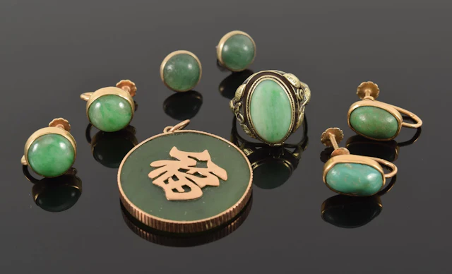 Assortment of jewelry. To include: 1) Pair of 14K gold round jade