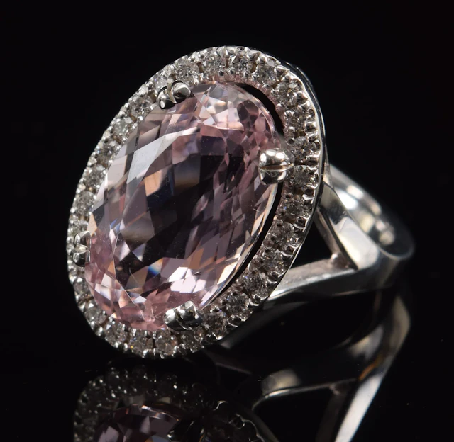 18K white gold kunzite and diamond ring. Elongated oval kunzite stone