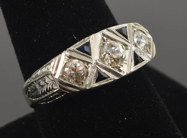 Art Deco 18K white gold diamond and sapphire ring. 3 round cut diamonds