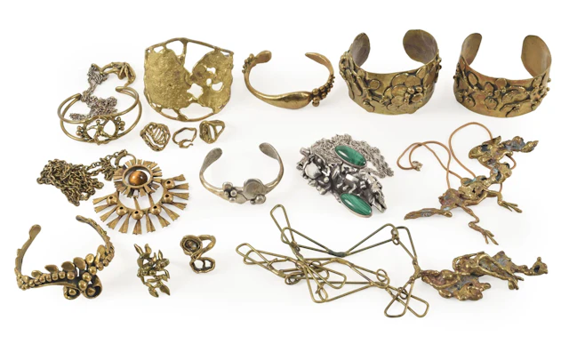 Selection of signed mid century brutalist style jewelry pieces. To