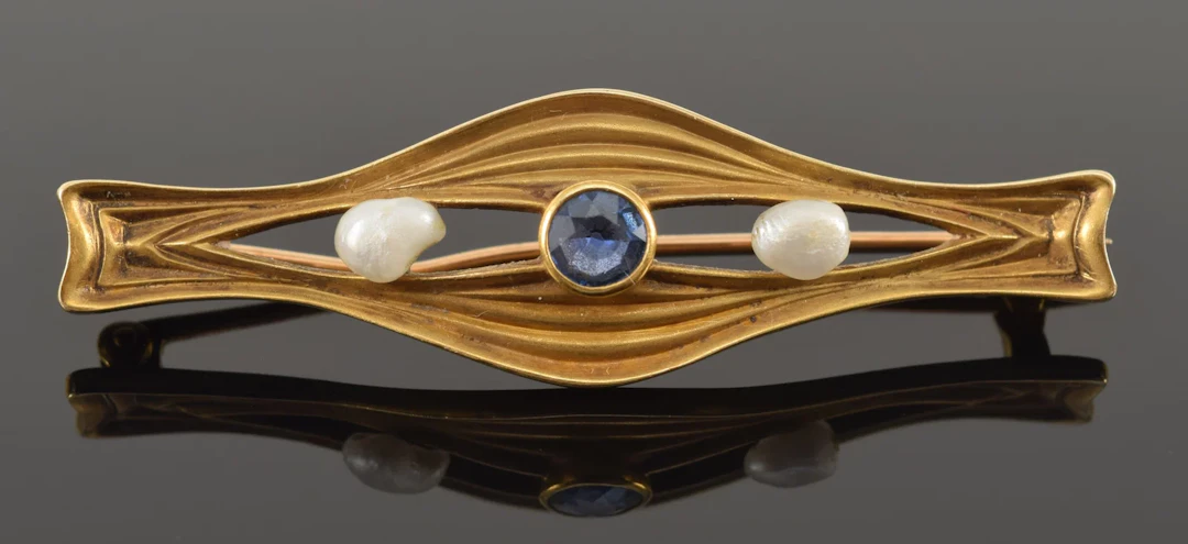 Vintage 14K gold sapphire and pearl bar pin. Creased design with open