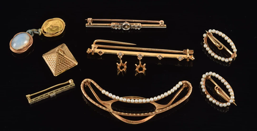 Lot of antique gold jewelry. To include: 14K gold seed pearl mounted