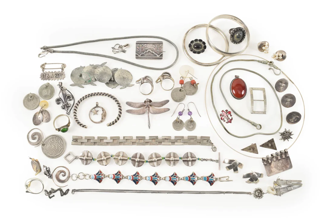 Large lot of assorted silver jewelry. To include: dragonfly pin, goat