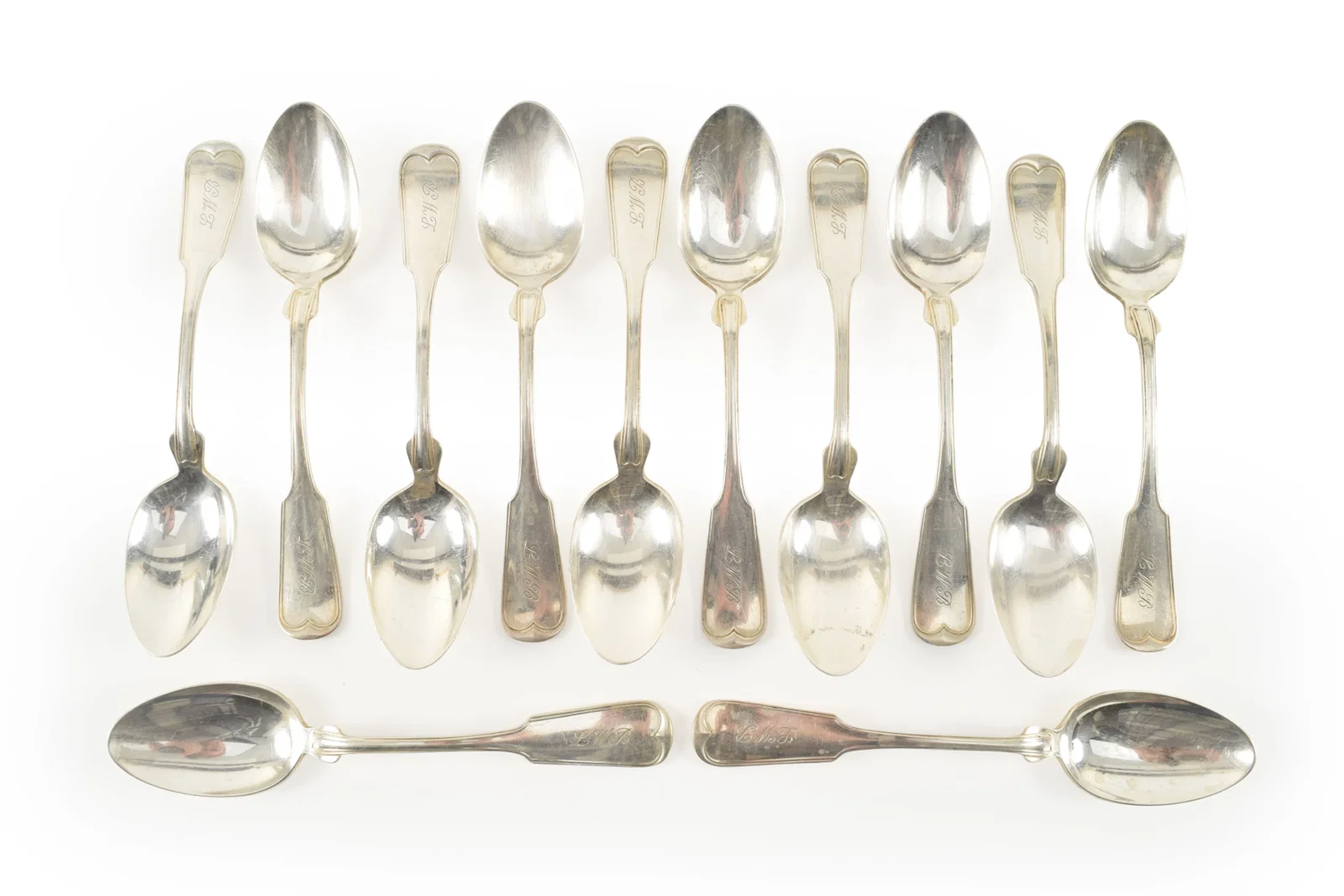 12 Cartier sterling silver fiddle and treat pattern teaspoons. Length