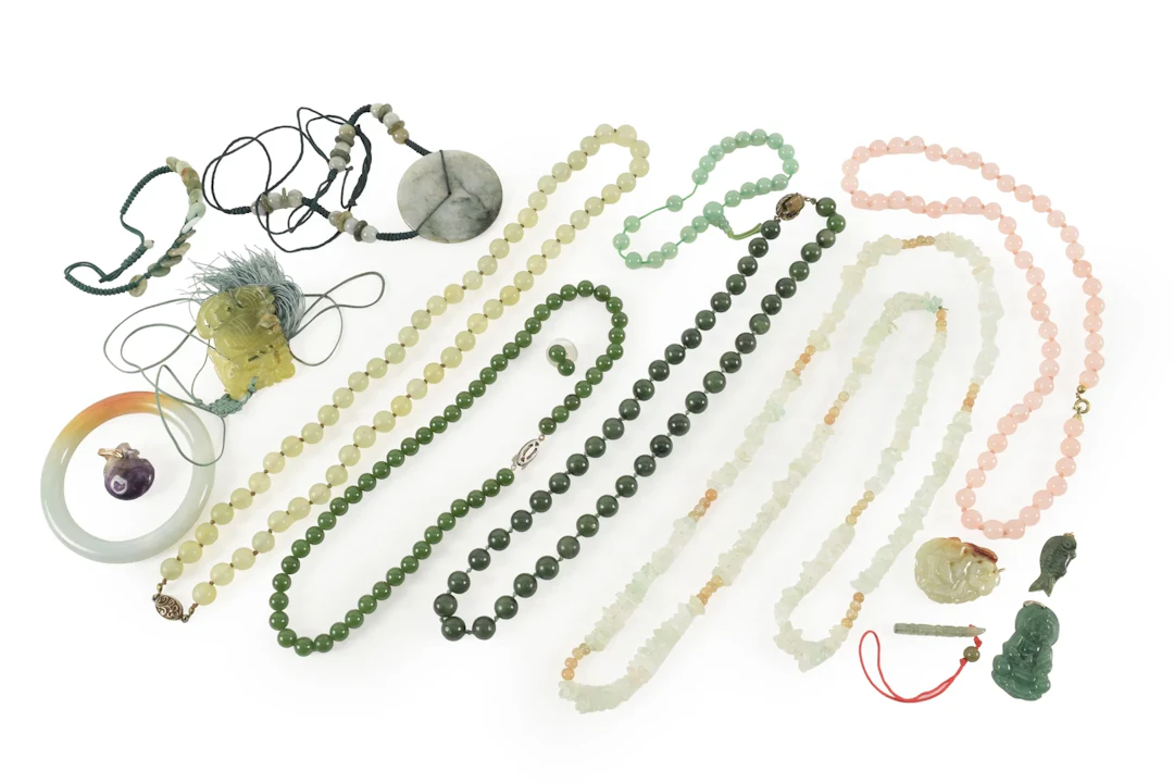 Assortment of hardstone jewelry, including jade bead necklaces and
