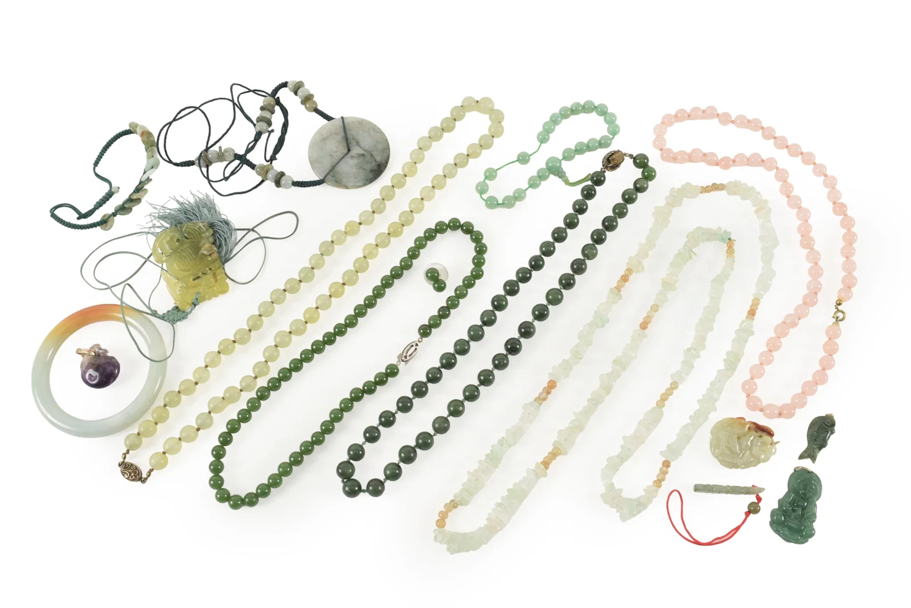 Assortment of hardstone jewelry, including jade bead necklaces and