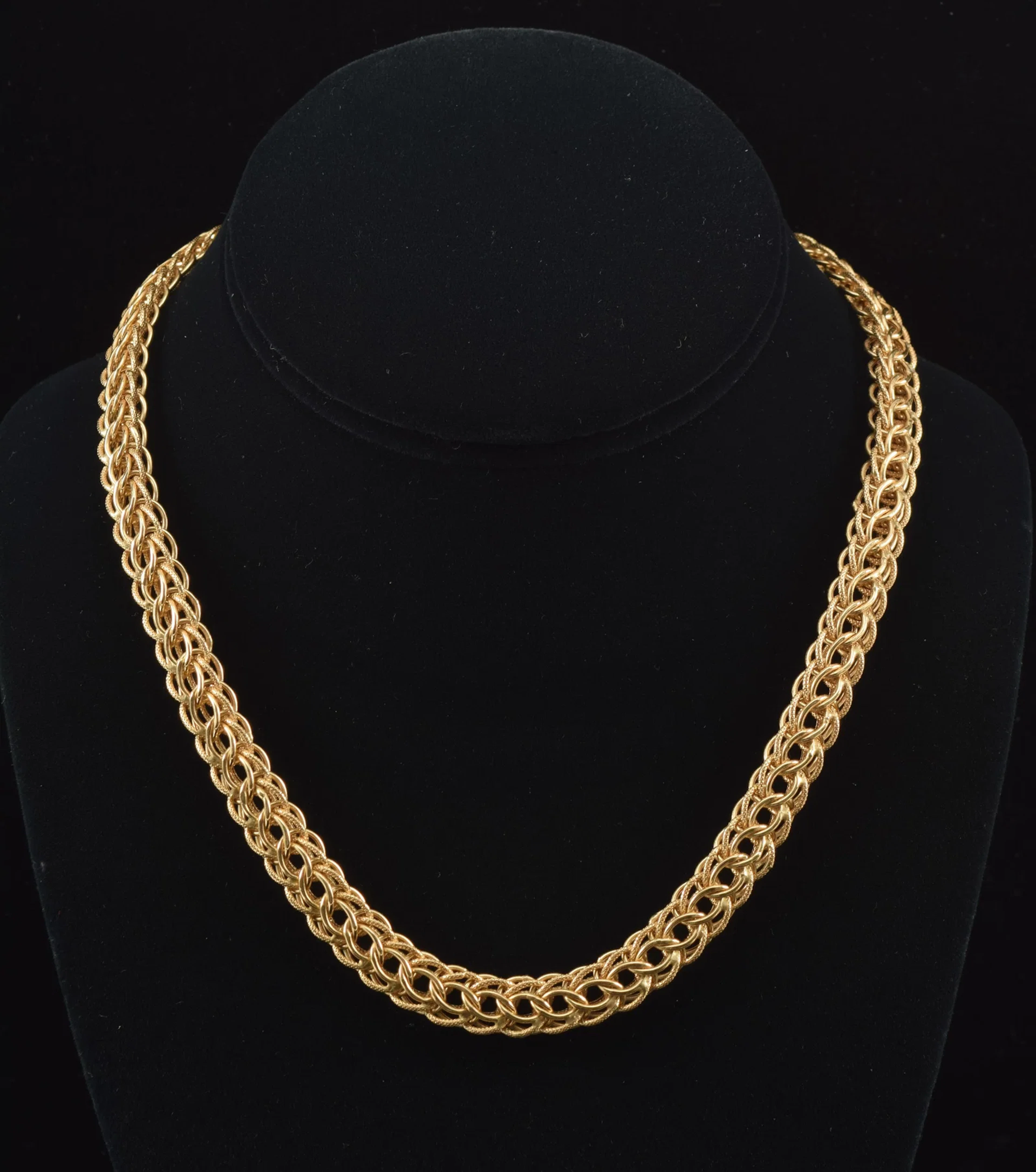 18K gold braided open link necklace. Textured and polished finishes.