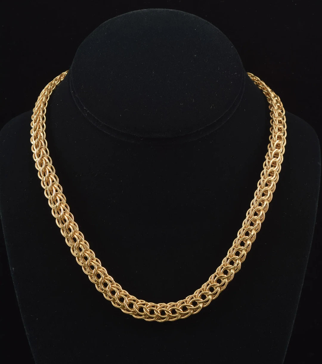 18K gold braided open link necklace. Textured and polished finishes.