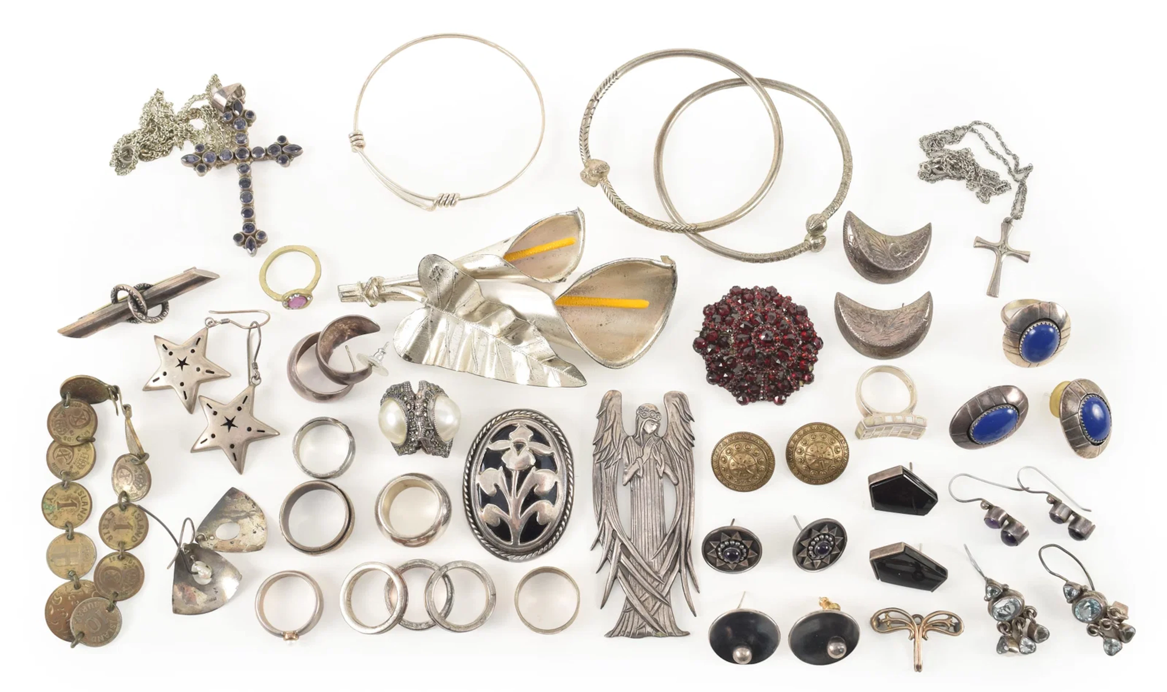 Selection of silver jewelry. To include gem set crucifix pendant necklace