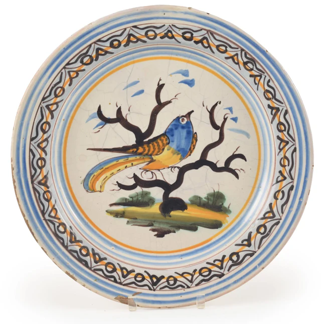 Antique majolica polychrome glazed charger with large bird on a branch