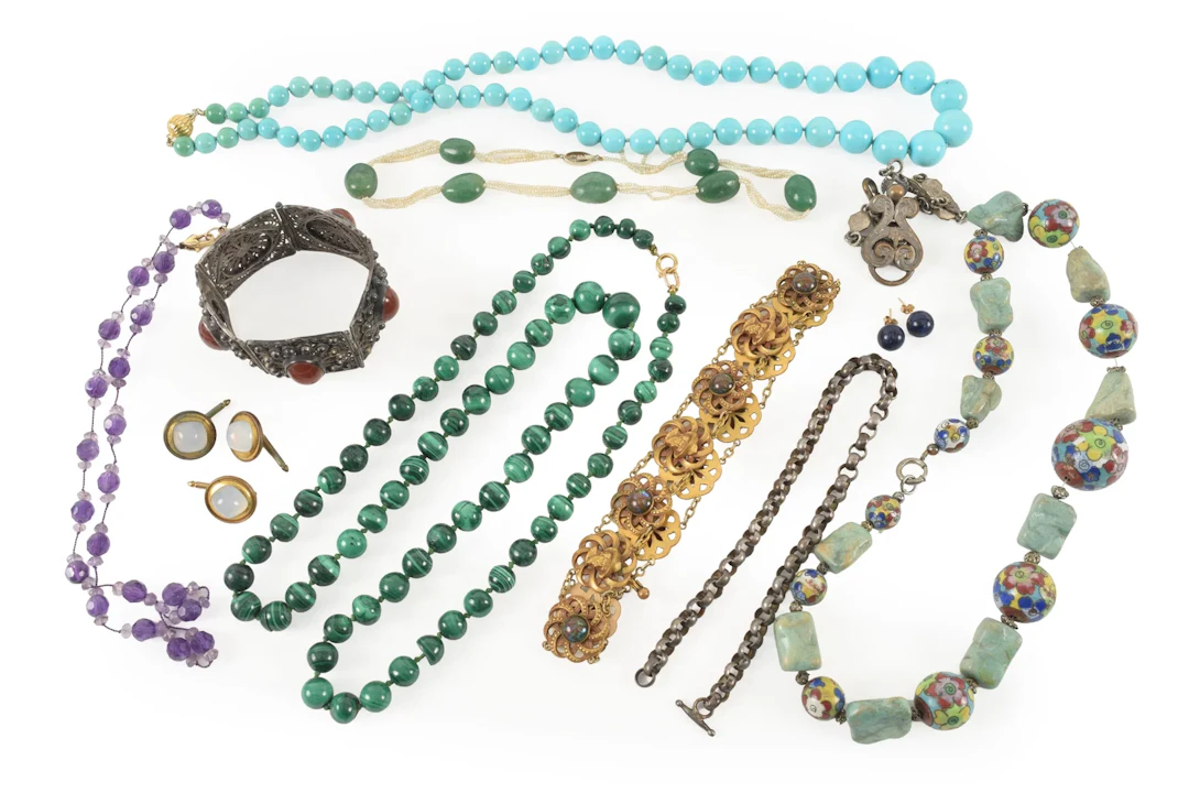 Assortment of antique and vintage jewelry, including silver segmented