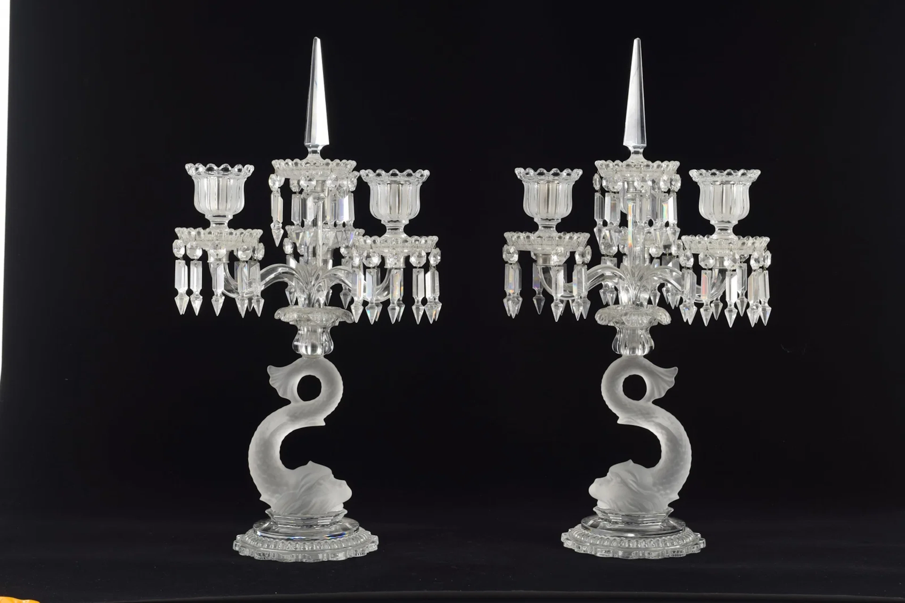 Pair of fine Baccarat crystal candelabras with dolphin standards and