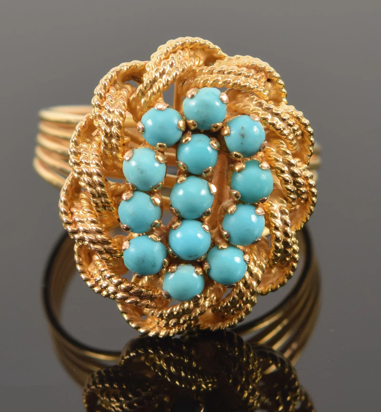 18K gold turquoise cluster ring. 13 round turquoise cabochons mounted
