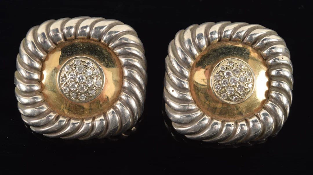 Gold and sterling silver diamond mounted earrings. Rounded square