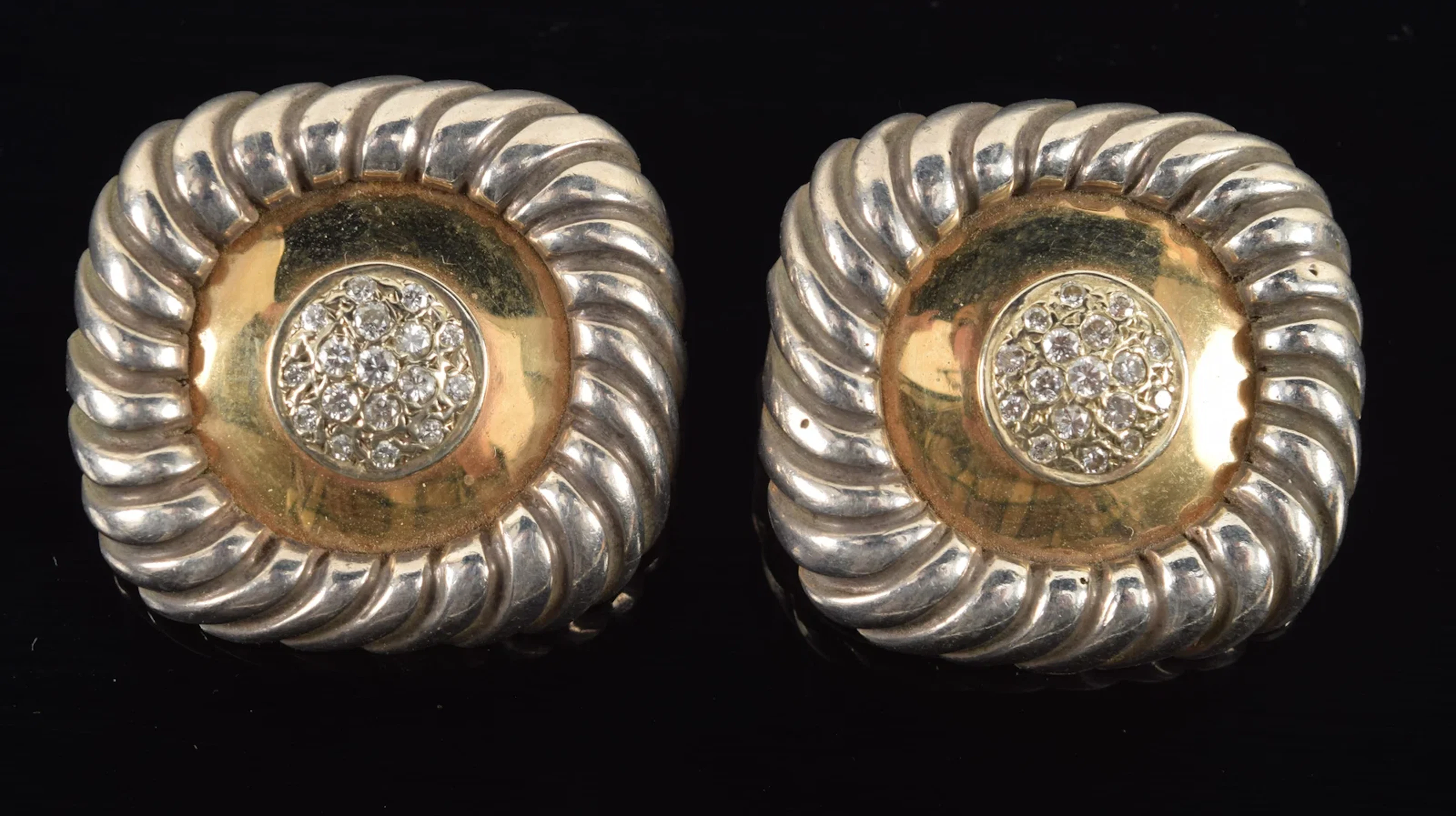 Gold and sterling silver diamond mounted earrings. Rounded square
