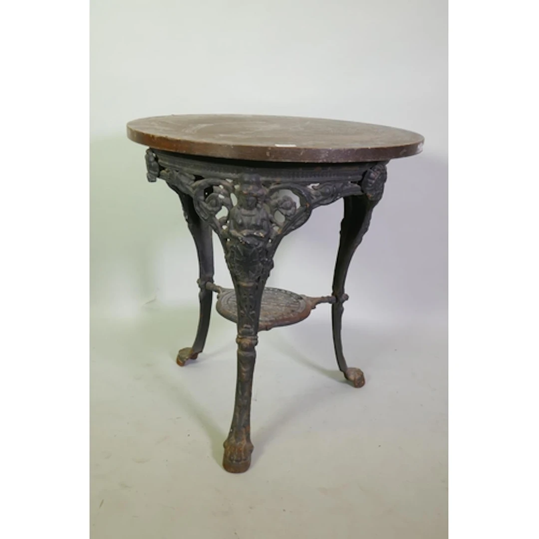 Victorian cast iron 'Britannia' pub table, with oak veneered...