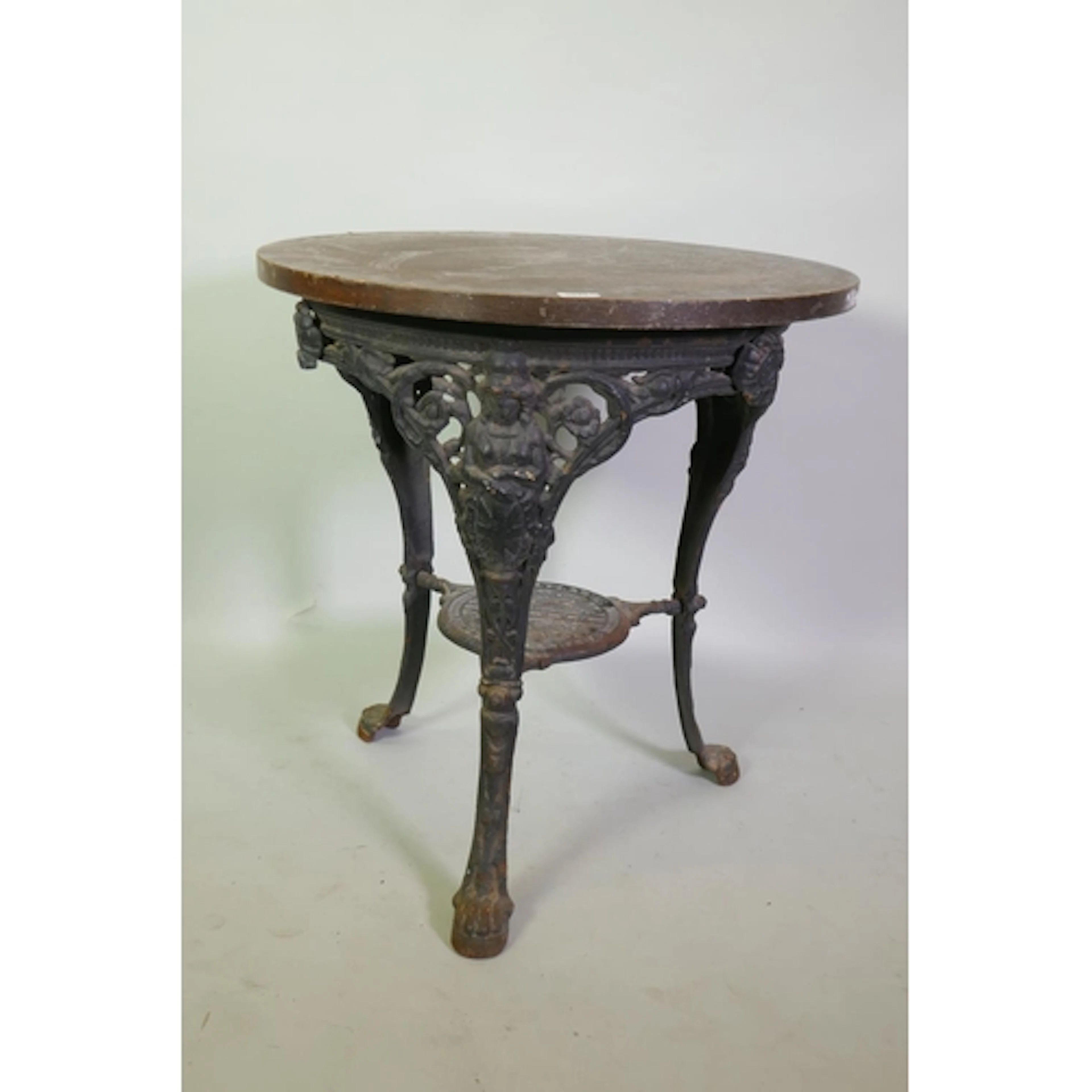 Victorian cast iron 'Britannia' pub table, with oak veneered...