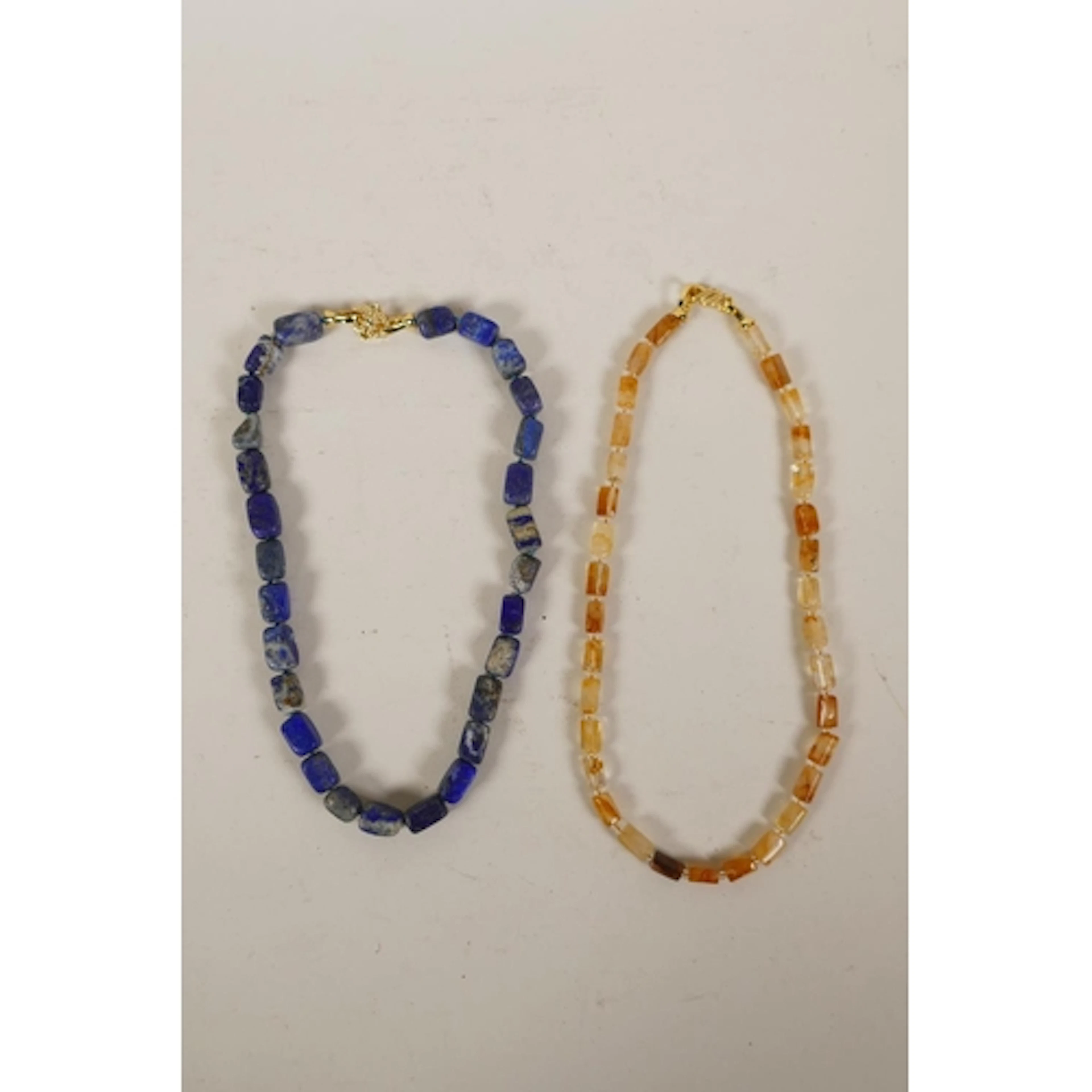 A citrine beaded necklace with gilt metal clasp and lapiz la...