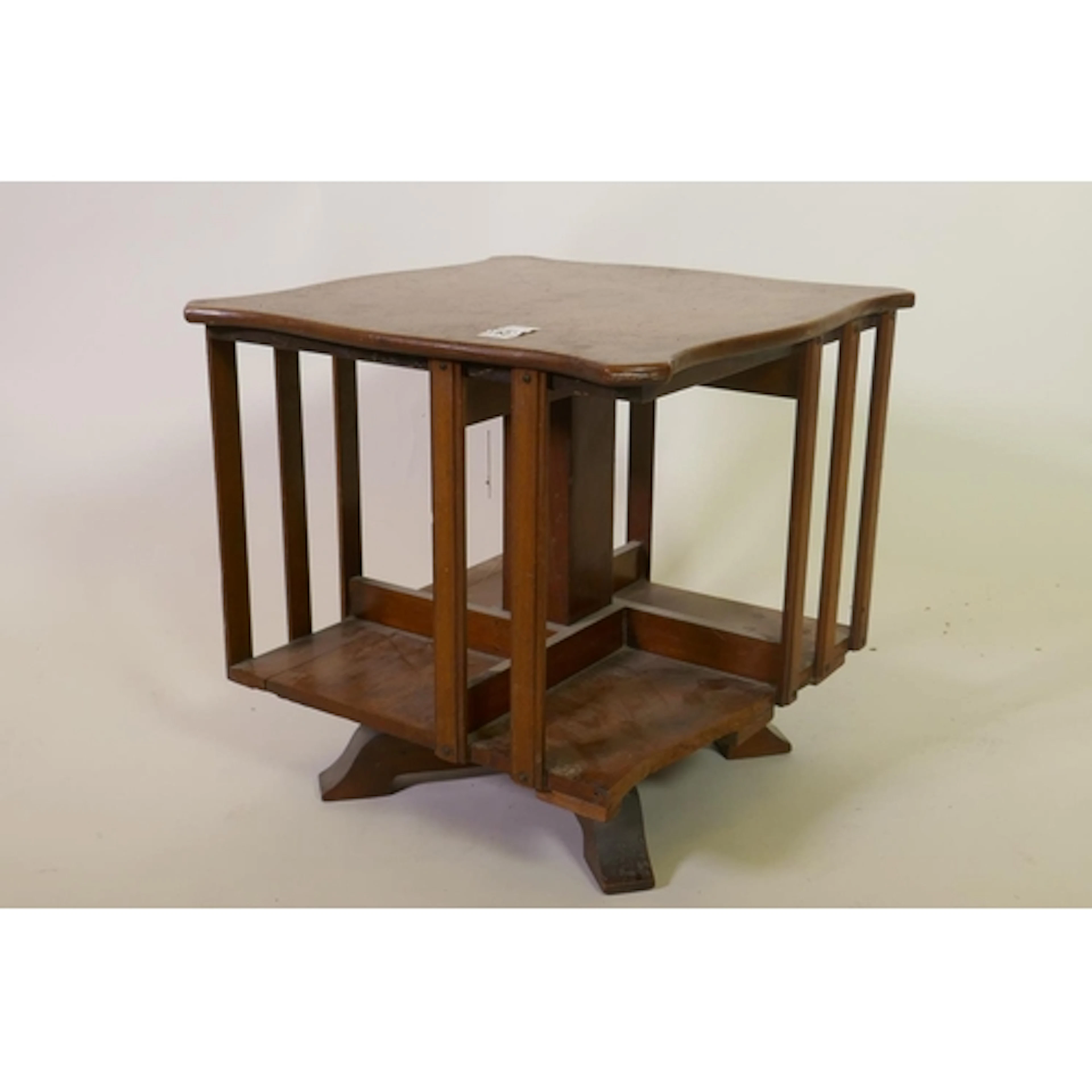 A walnut revolving desktop book rack, 37 x 37 x 38cm