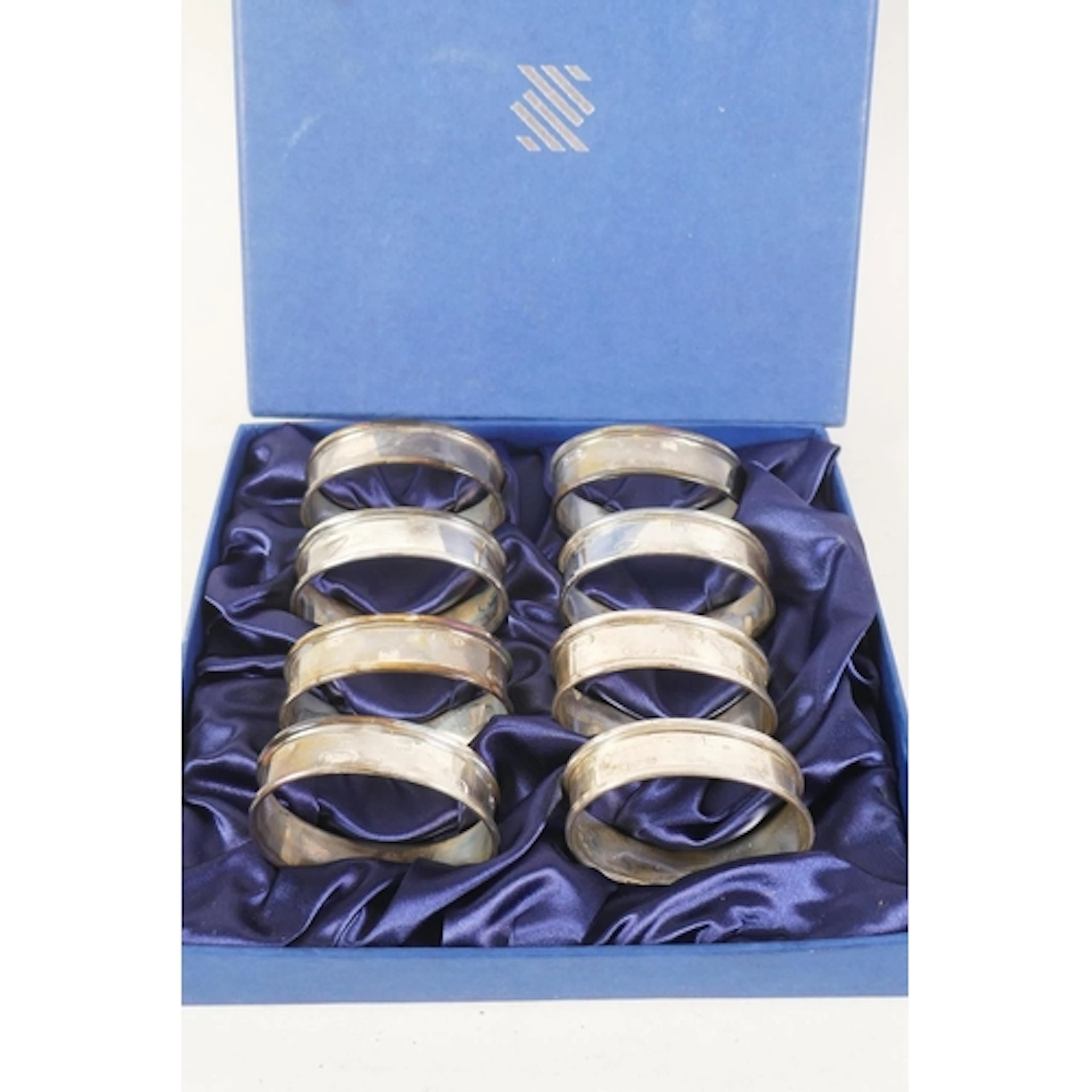 Set of 8 cased hallmarked napkin rings, Birmingham 2004, WI ...