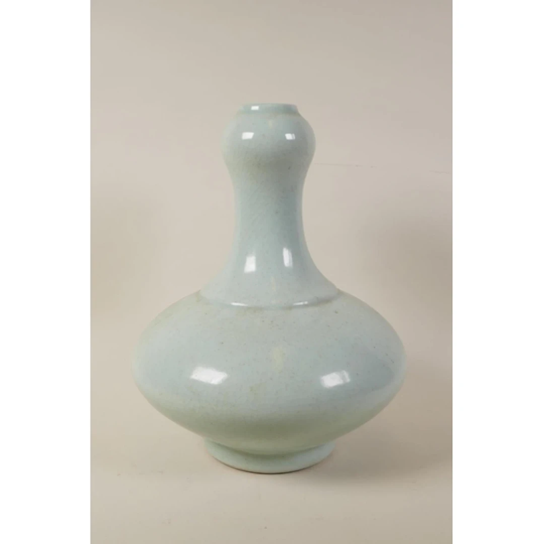A Chinese duck egg blue crackle glazed porcelain garlic head...
