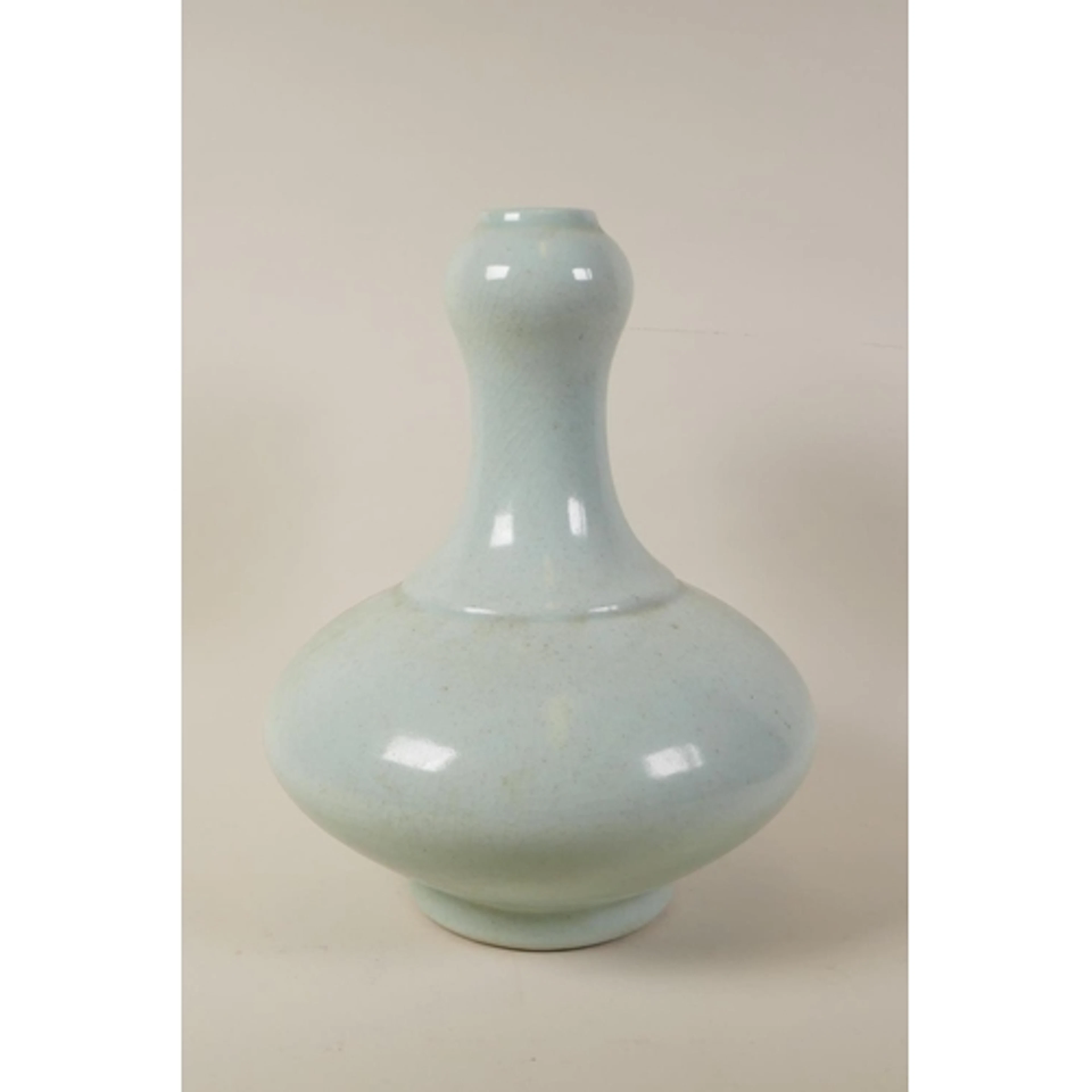 A Chinese duck egg blue crackle glazed porcelain garlic head...