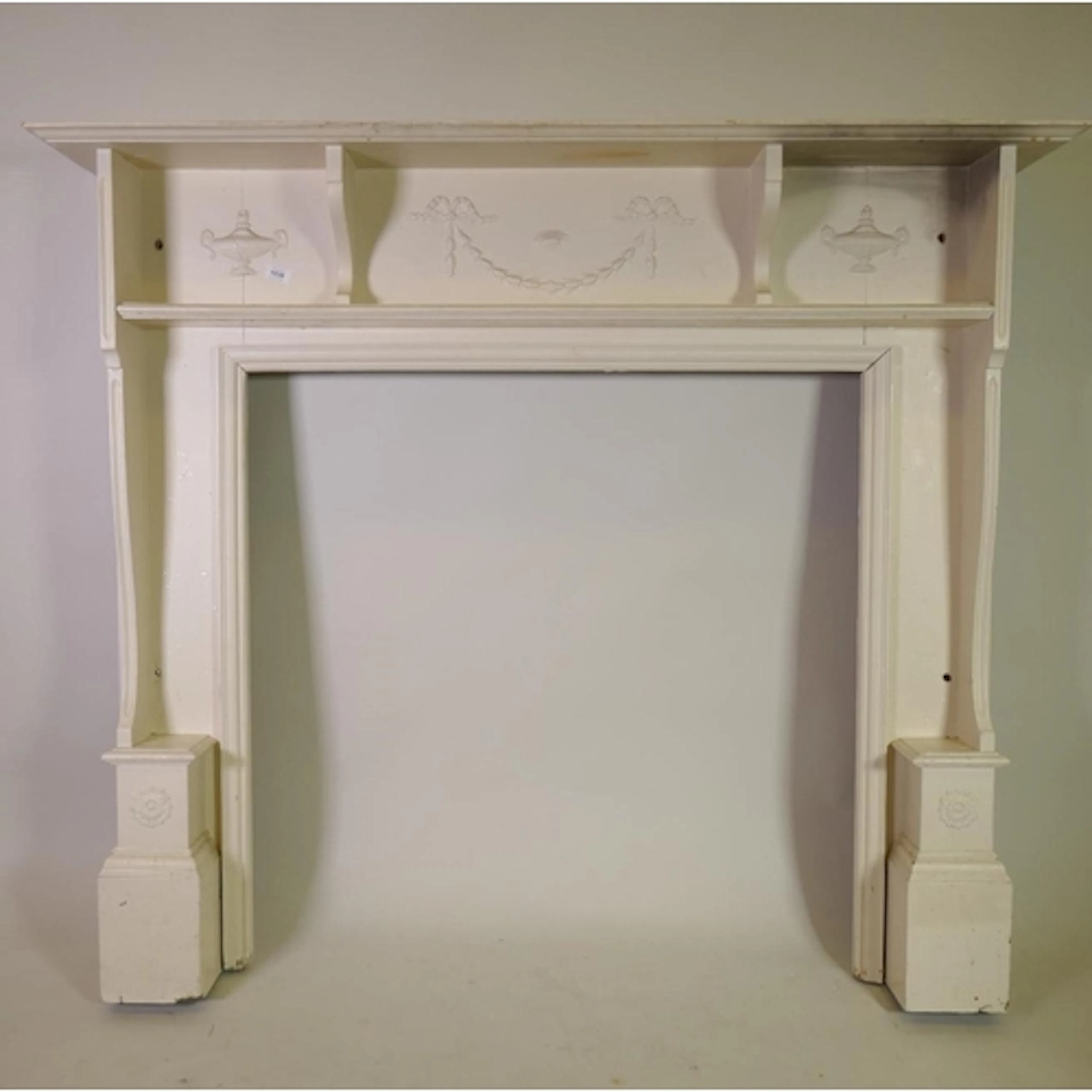 Antique painted pine fire surround with Adam style decoratio...