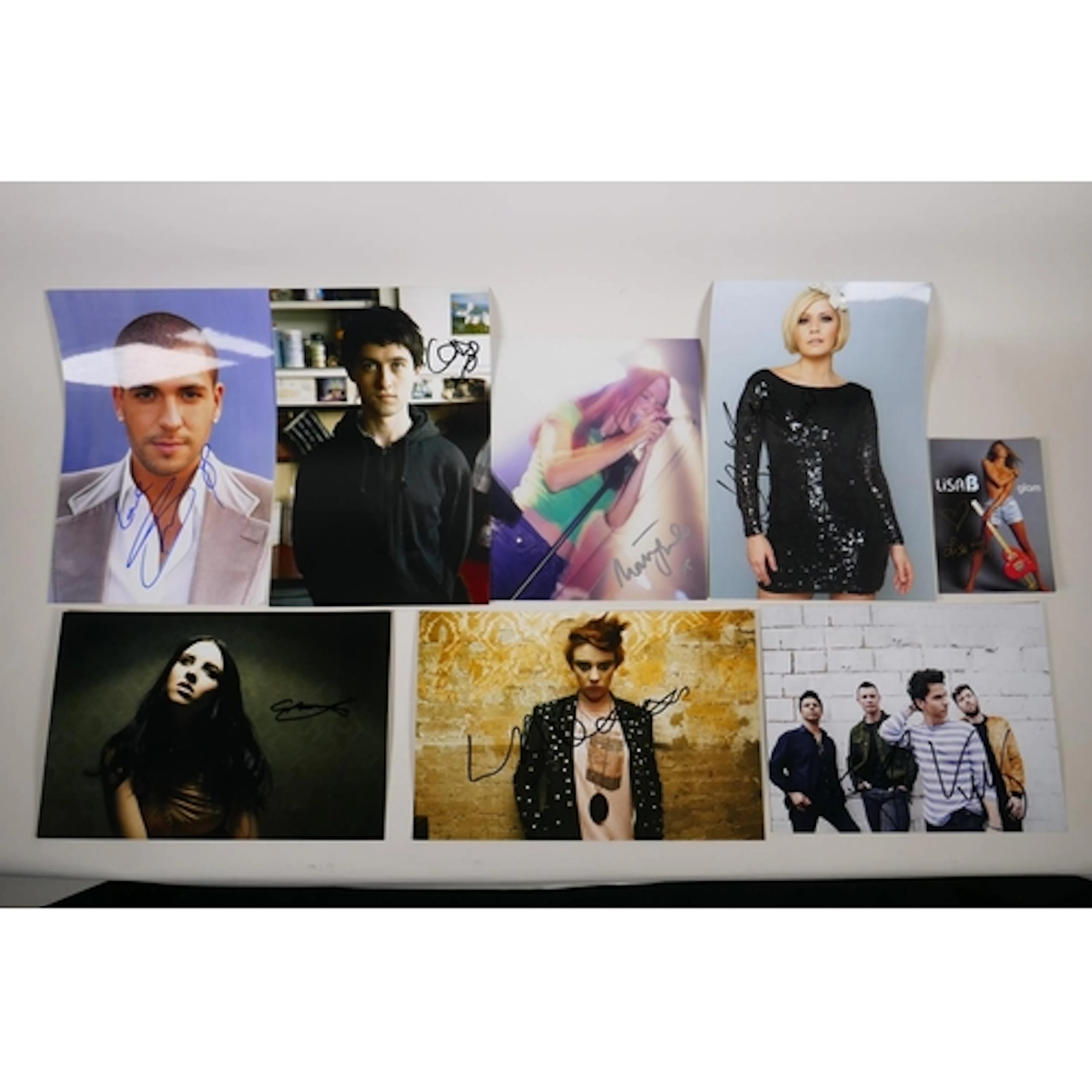 A collection of music publicity photos, many signed, includi...