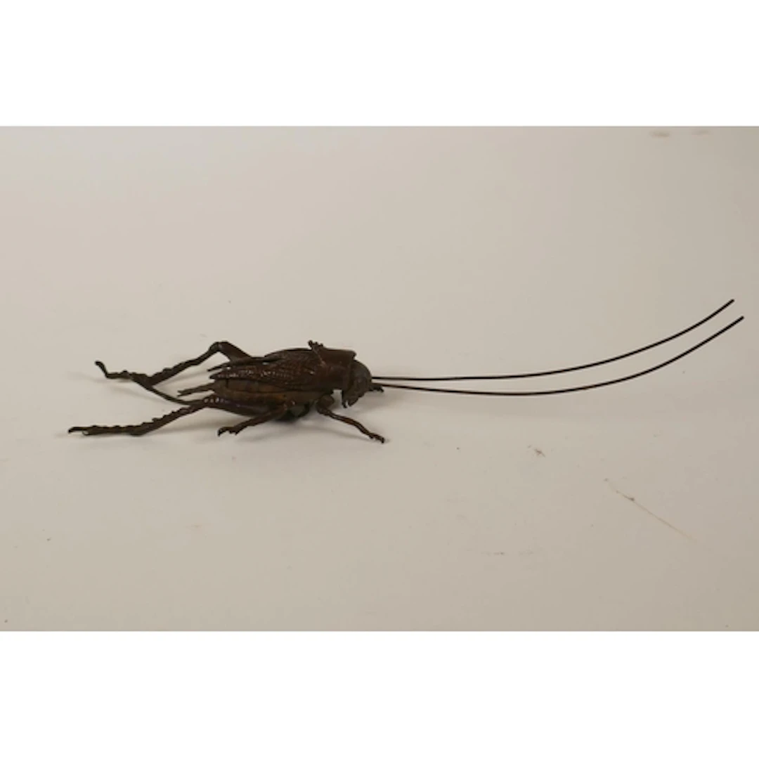 A Japanese jizai style bronze cricket with articulated limbs...